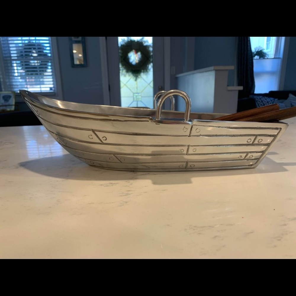 Never used silver serving bowl (boat shape). Comes with wooden utensils.